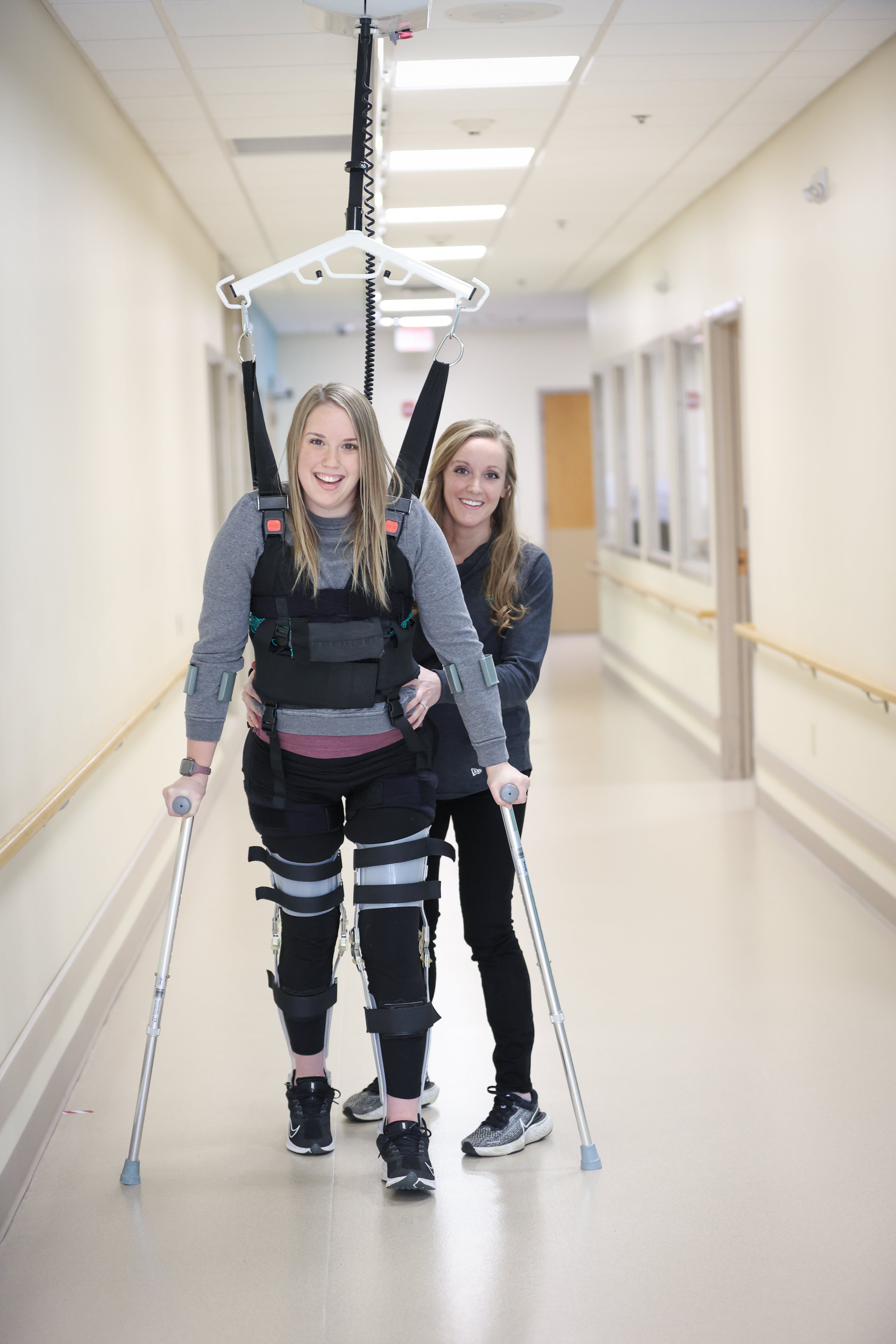 Mackenzie Nash walking with therapist